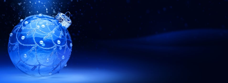 art Christmas banner or greeting card design. Christmas tree balls on blue snow background. Wide Xmas banner mockup, header, flyer photo