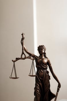 Business and lawyers discussing contract papers with brass scale on desk in office. Law, legal services, advice, justice and law concept picture with film grain effect photo
