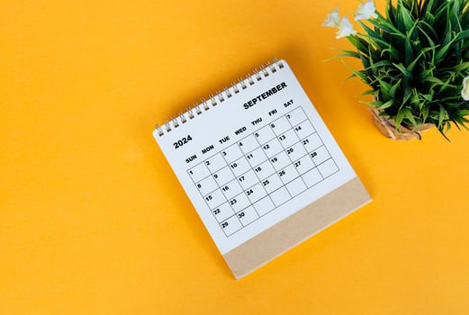 September 2024 desk calendar on yellow background. Directly above. Flat lay. photo