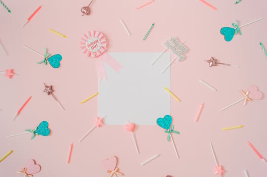 Pattern made of birthday party things on light pink background. Creative birthday girl concept. Minimal birthday party idea. Flat lay. Paper card copy space for text. photo