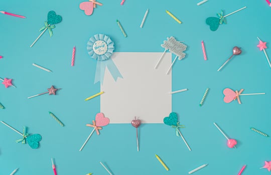 Pattern made of birthday party things on light blue background. Creative birthday boy concept. Minimal birthday party idea. Flat lay. Paper card copy space for text. photo
