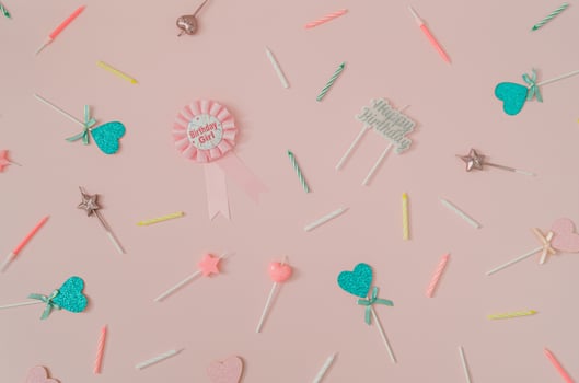 Beautiful pattern made of birthday party things on light pink background. Creative birthday girl concept. Minimal birthday party idea. Trendy flat lay pattern composition. Top of view. photo