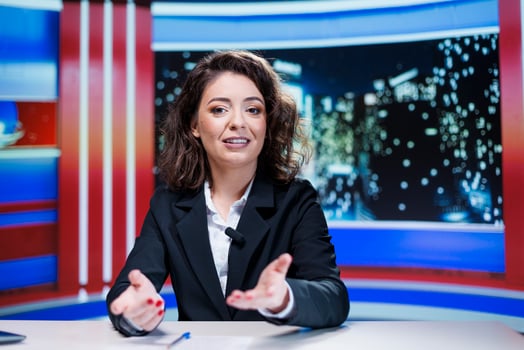 Journalist covering important topics on live television program, reporting breaking news and information from newsroom. Media newscaster reviewing headlines for interesting daily events. photo