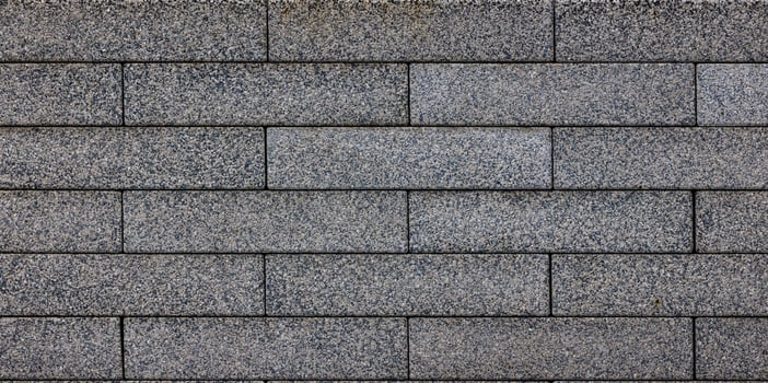 flat texture and full-frame background of gray long rectangular brick pavement photo