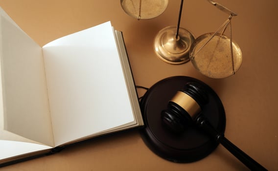 Business and lawyers discussing contract papers with brass scale on desk in office. Law, legal services, advice, justice and law concept picture with film grain effect photo