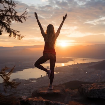 Woman stretching with sunrise in the background photo