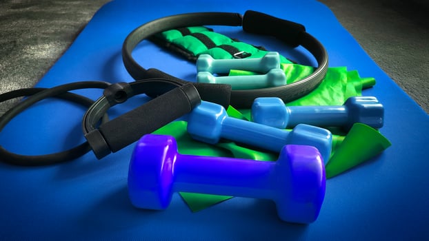 fitness equipment, dumbbells, resistance band, leg weight, ring photo