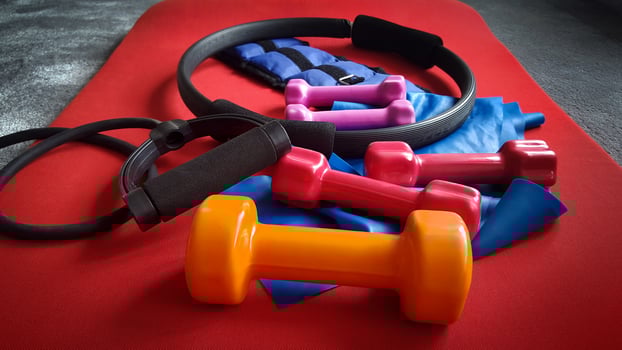 fitness equipment, dumbbells, resistance band, leg weight, ring photo