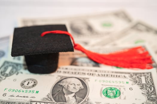 Graduation gap hat on Euro and US dollar banknotes money, Education study fee learning teach concept. photo