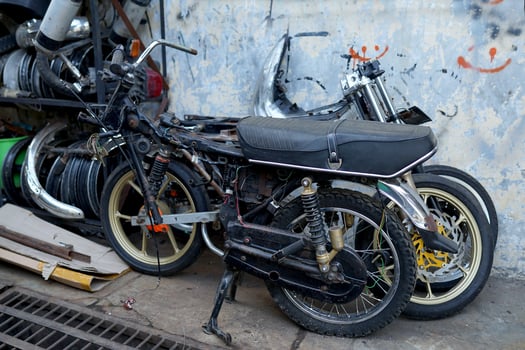 Solo, Indonesia - June 18, 2022 traditional market, scrap metal motorcycle chassis and flea goods for resale photo