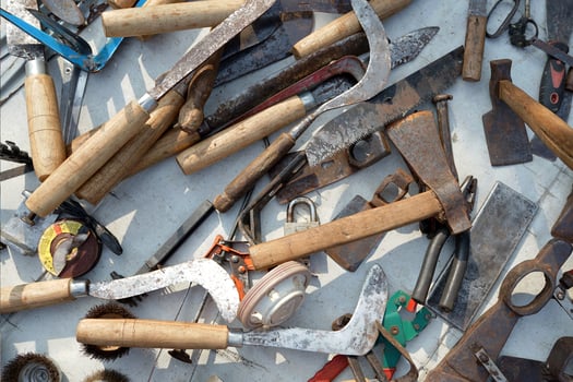 scrap metal flea market, a collection of weapons, swords, knives and axes for sale photo