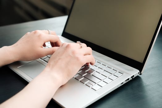 Productive Workspace. Woman's Hands Typing on Laptop Keyboard, Balancing Work and Learning at Office, Embracing Online Learning, Internet Marketing, Freelancing, and Work from Home Concept photo