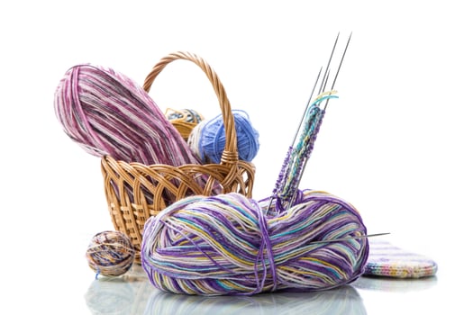 Colored threads, knitting needles and other items for hand knitting photo