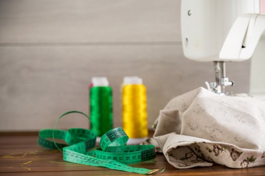 Sewing machine with fabric and threads for sewing, close-up. The working process photo