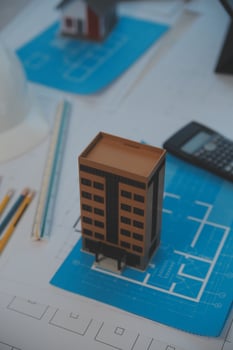 Construction and structure concept of Engineer or architect meeting for project working with partner and engineering tools on model building and blueprint in working site, contract for both companies. photo