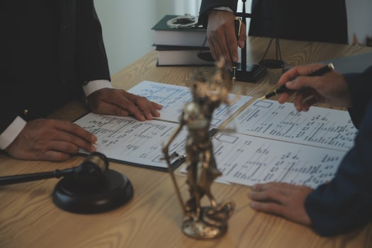 Consultation and conference of Male lawyers and professional businesswoman working and discussion having at law firm in office. Concepts of law, Judge gavel with scales of justice. photo