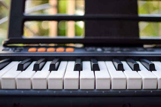 Close-up of piano keys. Piano black and white keys and Piano keyboard musical instrument placed at the home balcony during sunny day. photo