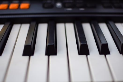 Close-up of piano keys. Piano black and white keys and Piano keyboard musical instrument placed at the home balcony during sunny day. photo