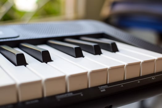 Close-up of piano keys. Piano black and white keys and Piano keyboard musical instrument placed at the home balcony during sunny day. photo