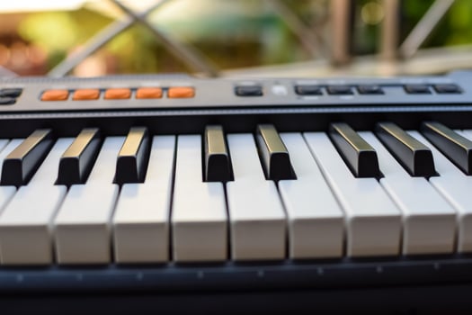 Close-up of piano keys. Piano black and white keys and Piano keyboard musical instrument placed at the home balcony during sunny day. photo