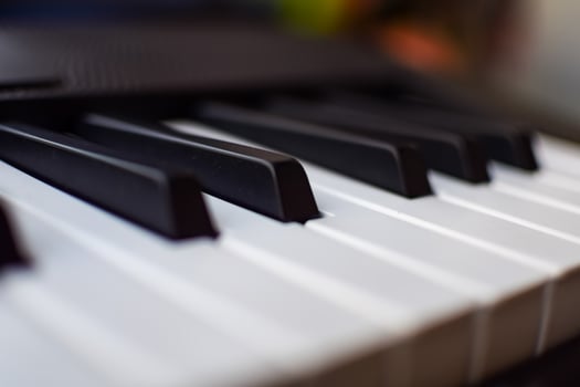 Close-up of piano keys. Piano black and white keys and Piano keyboard musical instrument placed at the home balcony during sunny day. photo