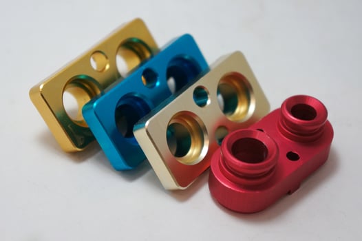 a batch of anodize aluminum cnc parts production. close-up. photo