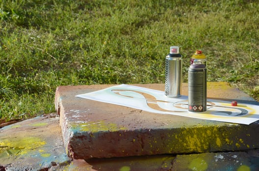 Kobra used spray cans for graffiti painting outdoors and stencil photo