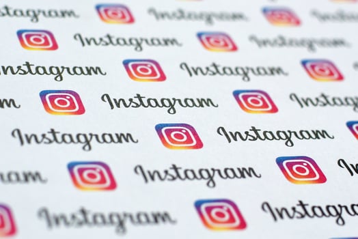 Instagram pattern printed on paper with small instagram logos and inscriptions. Instagram is American photo and video-sharing social networking service owned by Facebook