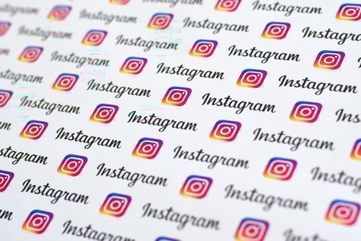 Instagram pattern printed on paper with small instagram logos and inscriptions. Instagram is American photo and video-sharing social networking service owned by Facebook