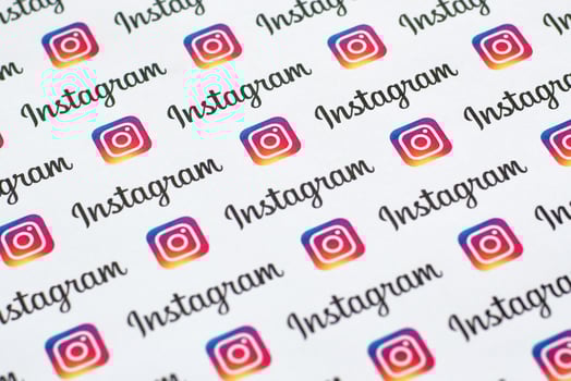 Instagram pattern printed on paper with small instagram logos and inscriptions. Instagram is American photo and video-sharing social networking service owned by Facebook