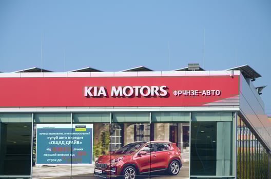 KHARKOV, UKRAINE - OCTOBER 20, 2019 Kia Automobile shop Dealership car logo Store sign. Kia Motors is South Korea automobile manufacturer photo