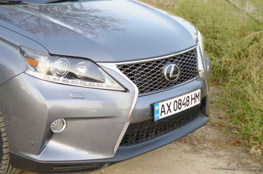 KHARKOV, UKRAINE - OCTOBER 21, 2019 Motor car Lexus RX350 AL10 in silver Color on country road. Front part view, Lexus is the luxury vehicle division of Japanese automaker Toyota photo
