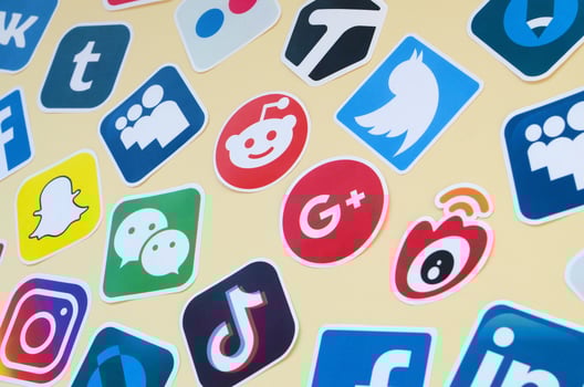 Many paper icons with logo of most popular social networks and smartphone apps for chat and conversations online photo