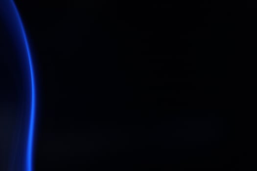 Blue smoke on a dark background photo