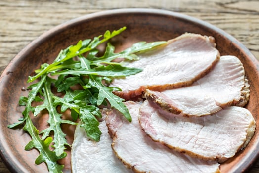 Baked meat with fresh rocket salad photo