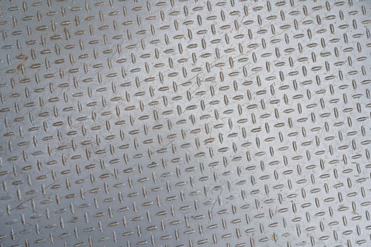 Metal floor plate with diamond pattern. Metal background or steel texture abstract. photo