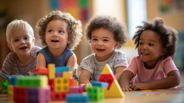 A group of children playing together and building with wooden blocks. photo