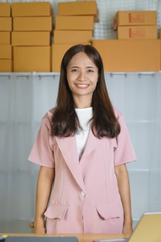 Business woman takes product promotional photos in a photo studio.