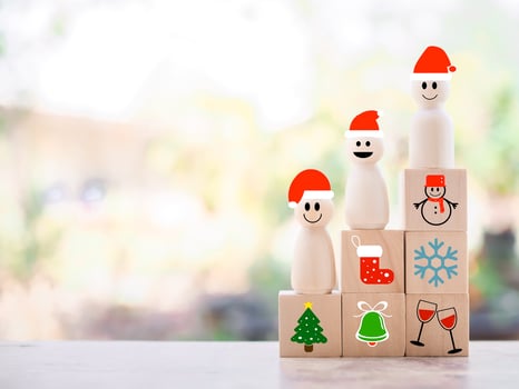 Wooden snowman with Christmas icons for Christmas decorations background photo