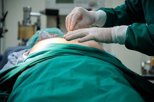 Close-up shot of professional doctor's hands with gloves. Specialist surgeons with surgery knife, prepare medical operations on critically ill patients in hospital's ICU, and paramedic occupation. photo