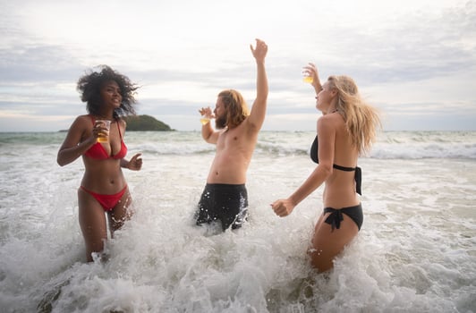 Group of friends having fun on the beach. Young women having fun on the beach. photo