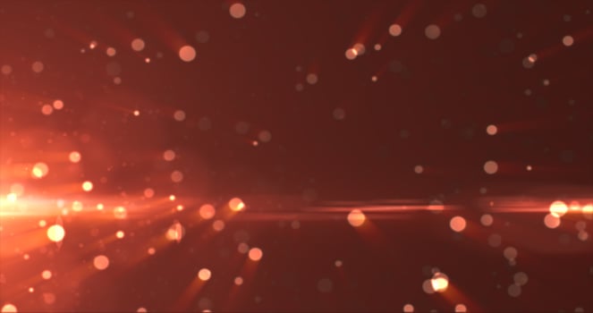 Abstract background of yellow orange gold glowing particles and bokeh dots of festive energy magic photo