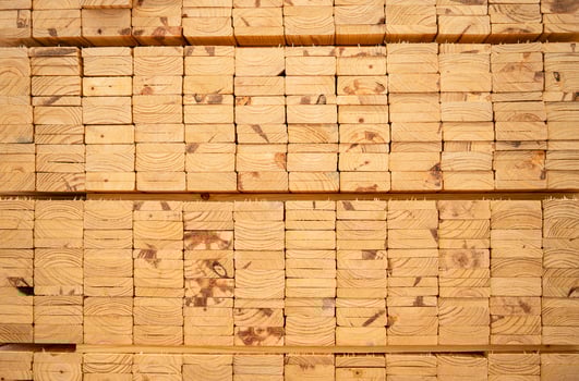 Wooden stacked in a warehouse, close-up. Wooden industrial background photo
