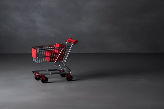 Composition of black friday shopping cart with gift boxes or bags on dark background and copy space concept by AI Generated photo