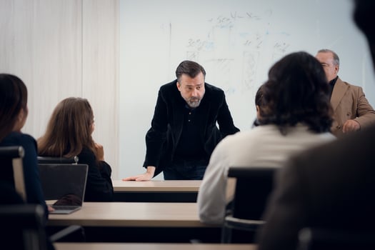 Portrait of a senior businessman giving a presentation to his colleague at office photo