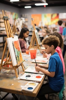 Children painting on easels in art class photo