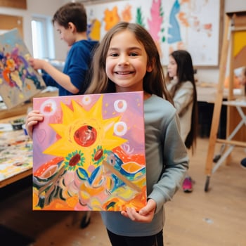 Child artist showing off their masterpiece to the camera photo