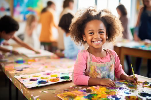 Child artist showing off their masterpiece to the camera photo