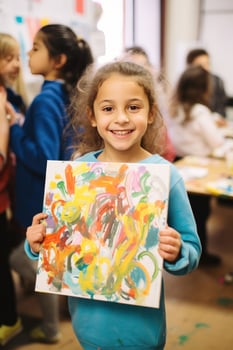 Child artist showing off their masterpiece to the camera photo