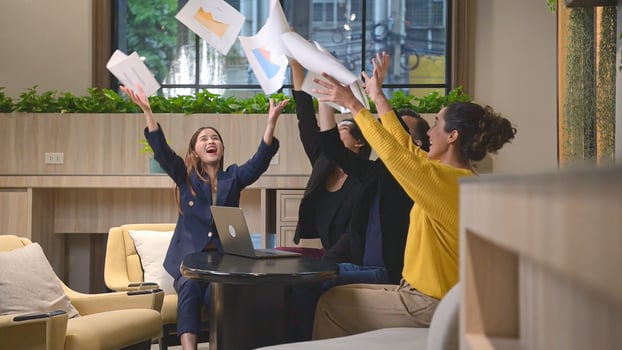 Group of happy business people celebrating success in office. Business success concept. photo